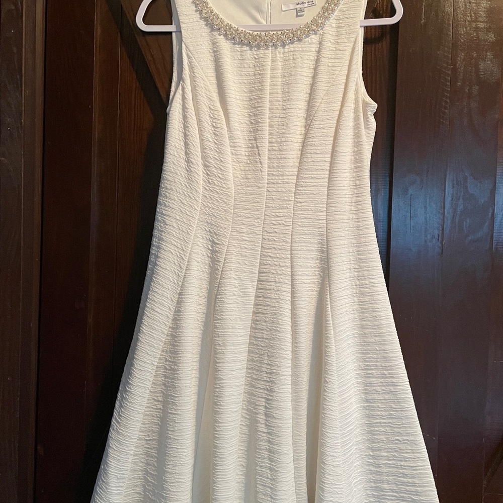 Elegant White Sleeveless Dress with Beaded Neckline